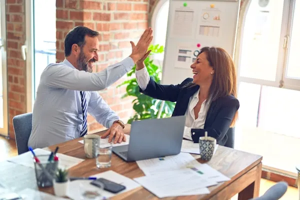 Business owner reviewing financial reports with an accountant in Augustine Heights